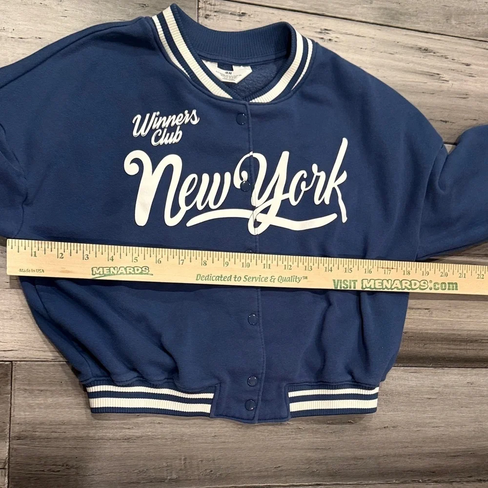 H&M Blue New York Varsity Jacket with White Lettering, includes the Cubs ball.